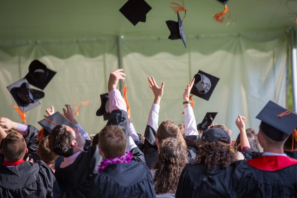 Professional school portrait Sydney graduation photo of children in cap and gown.